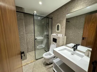 a bathroom with a toilet and a sink and a shower at Duplex franceville in Casablanca