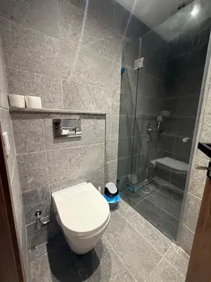 a bathroom with a toilet and a shower at Appartement chic Rabat in Rabat