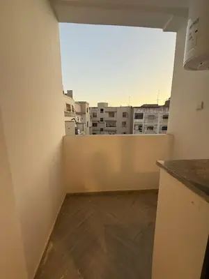 an empty room with a view of a city at Appartement chic Rabat in Rabat