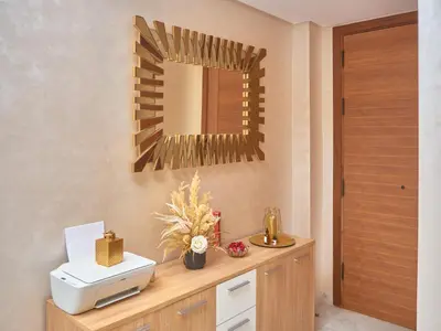 a bathroom with a sink and a mirror on the wall at Appartement haut standing in Casablanca