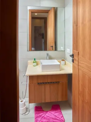 a bathroom with a sink and a mirror at Appartement haut standing in Casablanca