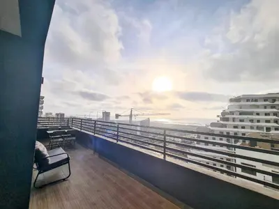 a view of the ocean from the balcony of a building at Duplex de Luxe avec Vue Mer a Zenata City-Eco in Aïn Harrouda