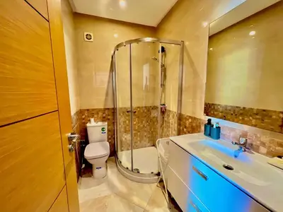 a bathroom with a shower and a toilet and a sink at Casabay Kettani Sidi Rahal in Sidi Rahal