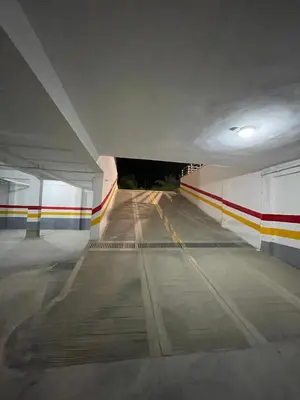 a view of a parking lot under a bridge at Two bedroom Apartment in Bouznika Beach in Bouznika