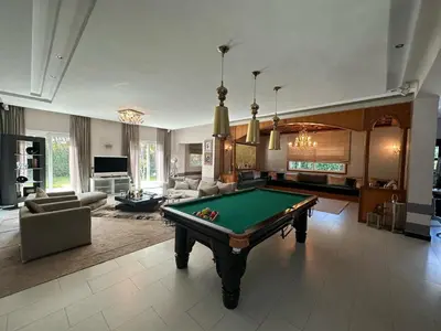 a living room with a pool table in it at Bouskoura park in Bouskoura