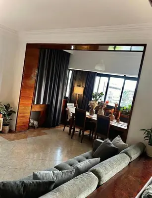 a living room with a couch and a dining room at Grand Appartement à Louer à Agdal, à Deux Pas de la Gare in Rabat