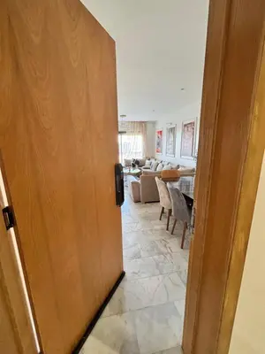 a door leading into a living room with a table at Morostay in Casablanca
