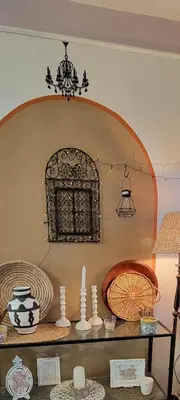 a room with a shelf with vases and a window at Spacious and convenient in Casablanca