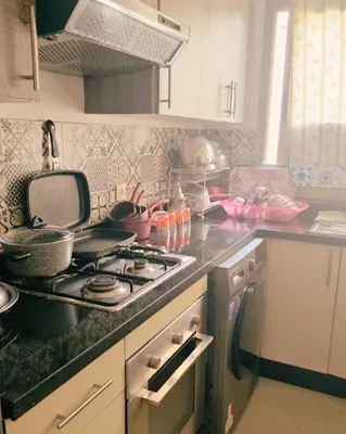 a kitchen with a stove and a counter top at Perfect Family Apartment in Tamaris