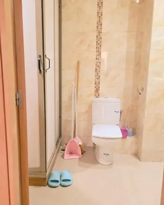 a bathroom with a toilet and a glass shower at Perfect Family Apartment in Tamaris