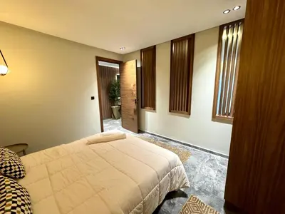 a bedroom with a bed in a room with windows at Studio casablanca connect in Casablanca