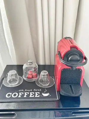 a table with a toaster and two cups on it at Ocean Dream in Casablanca