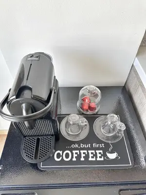 a coffeemaker with two cups of coffee on a table at Ocean Dream in Casablanca