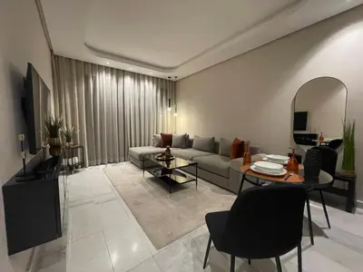 a living room with a couch and a table at A 1 pas de Zara Magnifique Studio Premium in Casablanca