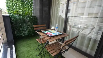 a table and two chairs on a balcony with a table at Central Quiet Spot in Casablanca