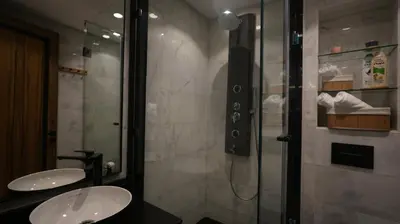 a bathroom with two sinks and a shower at Central Quiet Spot in Casablanca