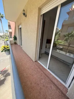a balcony of a house with a sliding glass door at Appartement 3 pièces à Mohammédia Proche Marjane, plage & restaurants in Mohammedia