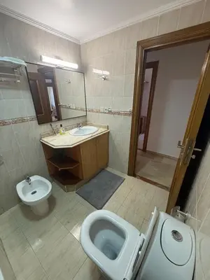 a bathroom with a toilet and a bidet and a sink at Appartement 3 pièces à Mohammédia Proche Marjane, plage & restaurants in Mohammedia