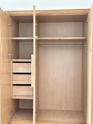 a closet with wooden doors and shelves at 3-marina Serena ocean-studio chic vue mer in Casablanca