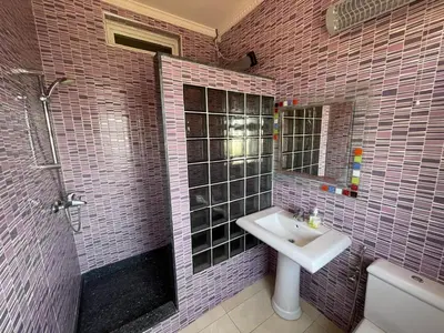 a bathroom with a sink and a shower at Villa Royale Prestige Safaa in Dar Bouazza
