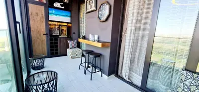 a restaurant with a bar with stools and windows at The Bleu waves in Casablanca