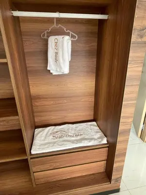 a walk in shower with a towel in a closet at Villa Chez Badre with Pool High Standing in Sidi Rahal