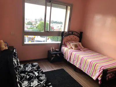 a small bedroom with a bed and a window at Apartment Galia Mohammedia in Mohammedia