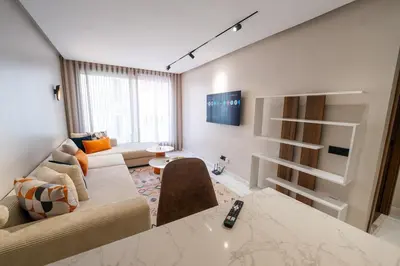 a living room with a couch and a table at Exclusive Apt Casa City Center in Casablanca