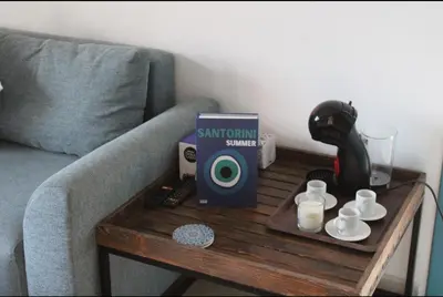 a coffee table with a box on top of a couch at K Playa Vibe Darbouazza in Dar Bouazza