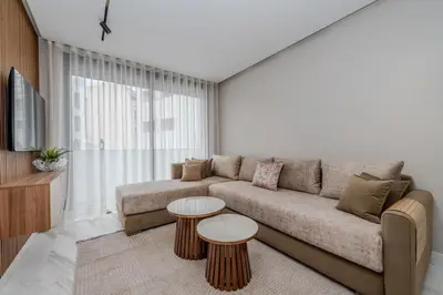 a living room with a couch and two tables at Stylish Apt Casa City Center in Casablanca