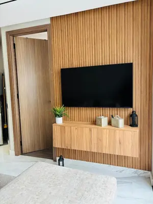 a flat screen tv on a wooden wall at Stylish Apt Casa City Center in Casablanca