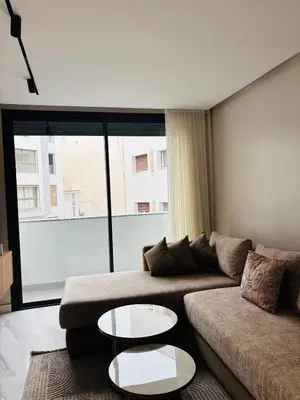 a living room with a couch and two tables at Stylish Apt Casa City Center in Casablanca