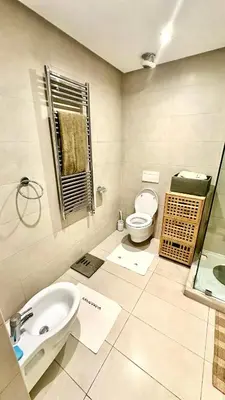 a bathroom with a toilet and a sink at 2 Bedroom Apartment in Casablanca