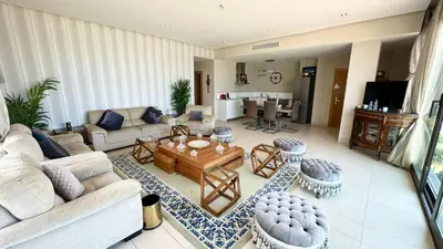 a living room with a couch and a table at 2 Bedroom Apartment in Casablanca