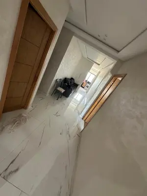 an overhead view of a room with white marble floors at Apparemment propre pour les familles in Casablanca
