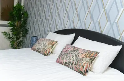 a bed with two pillows on top of it at Hamouda Tabina in Rabat