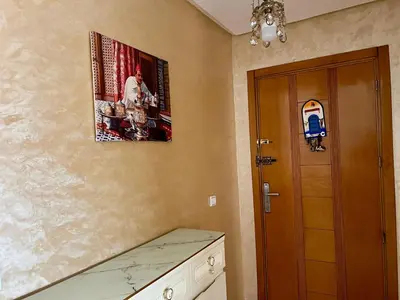 a kitchen with a door and a picture on the wall at Urban Comfort Casablanca - 3BR Family Apartment in Casablanca