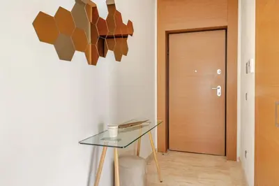 a hallway with a glass table and a door at Harcay CFC in Casablanca