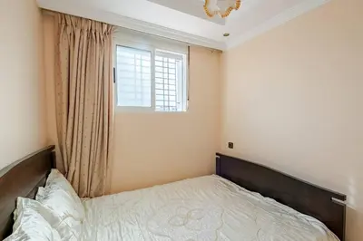 a bedroom with a bed and a window at Layover Guest House - Studio Rabat City Center - 4th Floor in Rabat