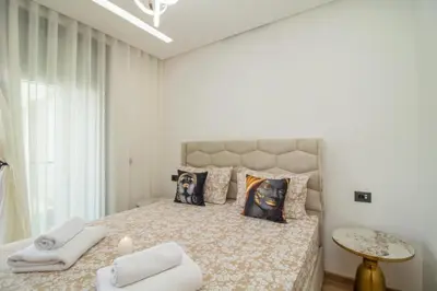 a bedroom with a large bed with towels on it at Skyline Retreat in Casablanca