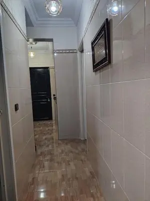 a hallway with a door and a tile wall at Casa Hasna in Casablanca