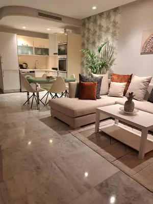 a living room with a couch and a table at Holiday Appart in Casablanca