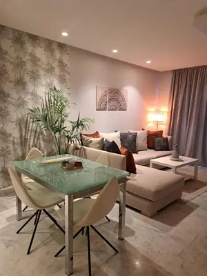 a living room with a couch and a table at Holiday Appart in Casablanca