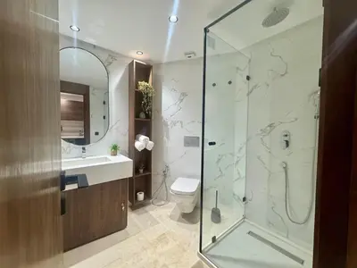 a bathroom with a shower and a toilet and a sink at Scandi Design Central Casablanca in Casablanca