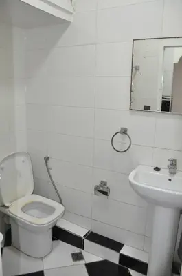 a bathroom with a toilet and a sink at Rental Apartment in Casablanca City Center in Casablanca