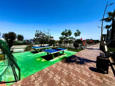 two ping pong tables in a pool of green water at Ocean side - Prestige & Douceur familliale in Casablanca