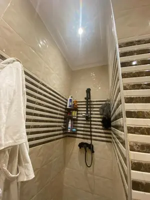 a bathroom with a shower and a sink at Dream villa with a pool