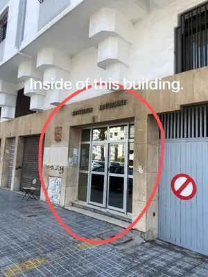 a building with a red circle in front of it at Happy hostel in Casablanca