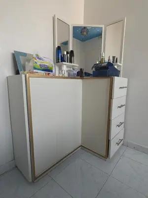a kitchen with a counter with white cabinets and a mirror at Mydar ocean in Rabat