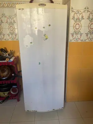 a white refrigerator freezer sitting in a kitchen at Comfort and Convenience in Casablanca